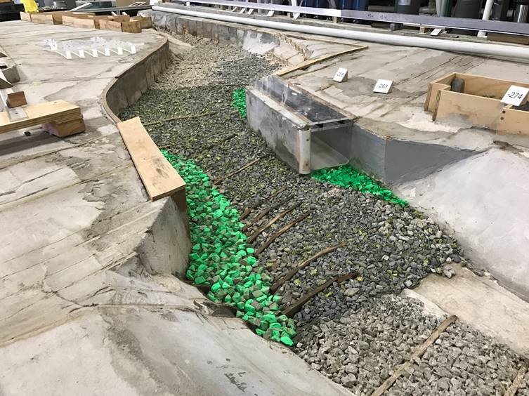 1:25 scale physical model of the Water of Leith at Dundas Street bridge, looking downstream. The proposed new culvert is at the right of the bridge.  The model was constructed at the Water Engineering Laboratory of the Department of Civil and Environmental Engineering, University of Auckland.