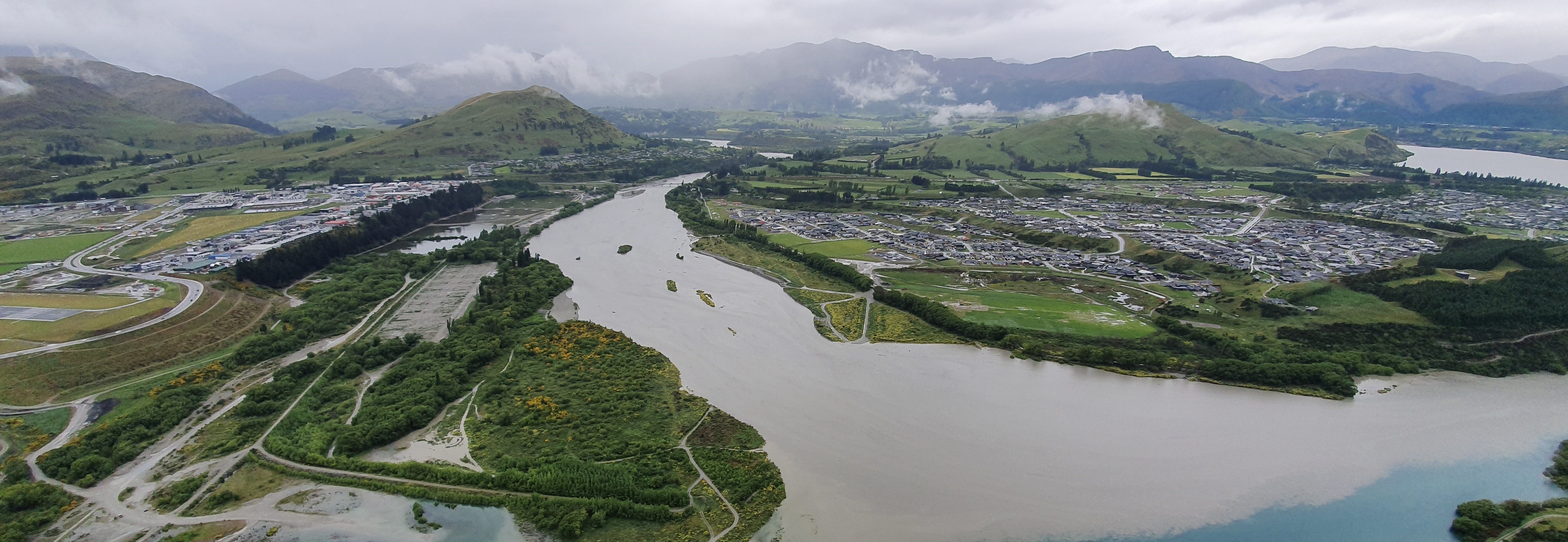 Shotover River as it enters the Kawarau River around 12:30pm 03/12/2019. The rock “training line” constructed by ORC in 2010 is at bottom left.