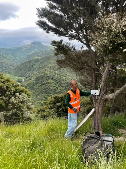 Martin Servicing An AT220 Possum Trap Overlooking Hikaroroa Mt Watkin And The North Branch Of The Waikouaiti River