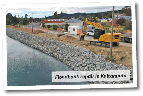Floodbank Repair In Kaitangata with digger building rock wal