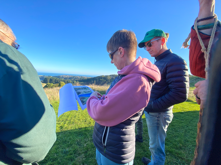 group of people discussing Lagoon standing outside - Tomahawk Lagoon Landowner Get Together 16 May 2026 - Janice Huang.png