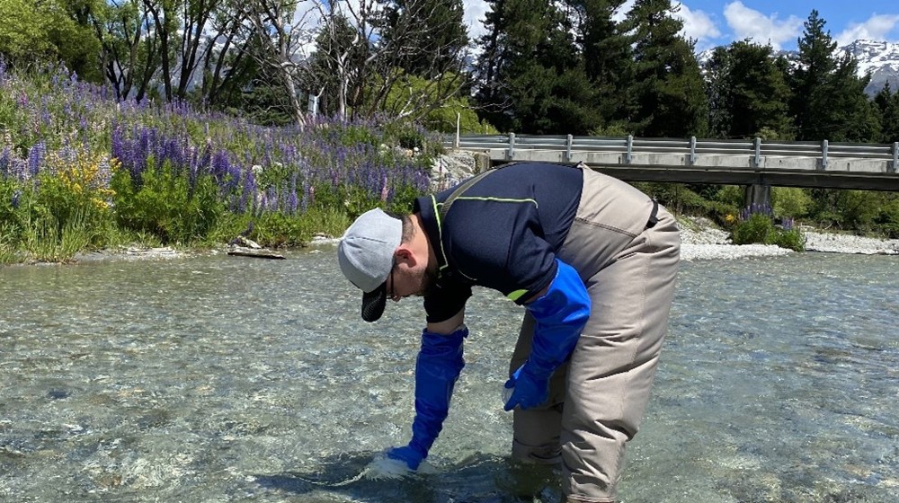 ORC’S Scientist, Science Facilitation, Markus Dengg Takes A Water Sample From The Buckler Burn, South Of Glenorchy. ORC Files